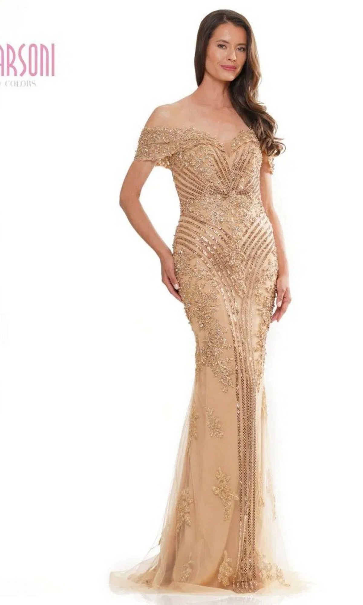 A woman wearing the Marsoni MV1275 long formal dress with an off-the-shoulder neckline and intricate beading poses against a white background.